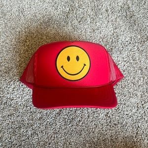 Red smiley trucker hat